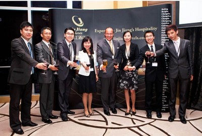 Bernold O. Schroeder, CEO at Jin Jiang International Hotels (fourth from right), Cinn Tan, SVP of Marketing & Sales (fourth from left), Victor Lim, Director of M&S (second from right), and Fabian Seet, International Director of M&S (third from left), share this happy moment with sales representatives from Jin Jiang Hotel, Hua Ting Hotel & Tower, Park Hotel and Rainbow Hotel in the opening celebration of its regional sales office in Singapore.